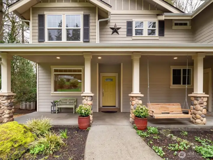 Inviting front door with patio overlooking the flat lawn.