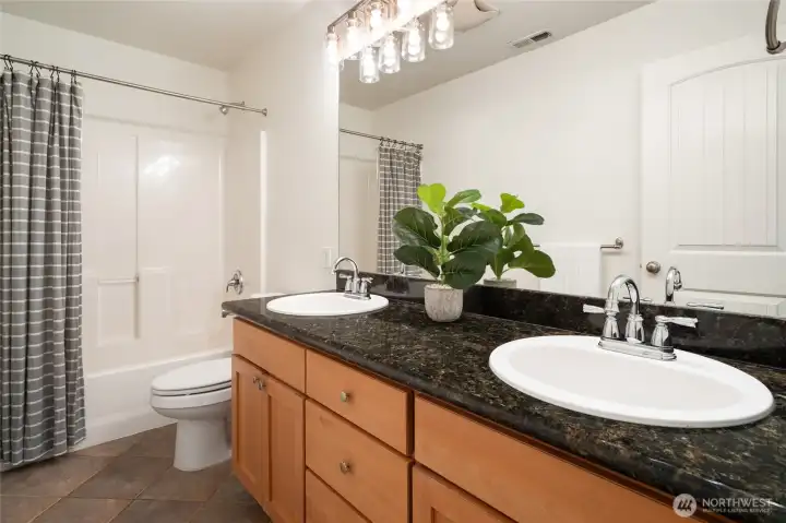 Hall bathroom with double sinks