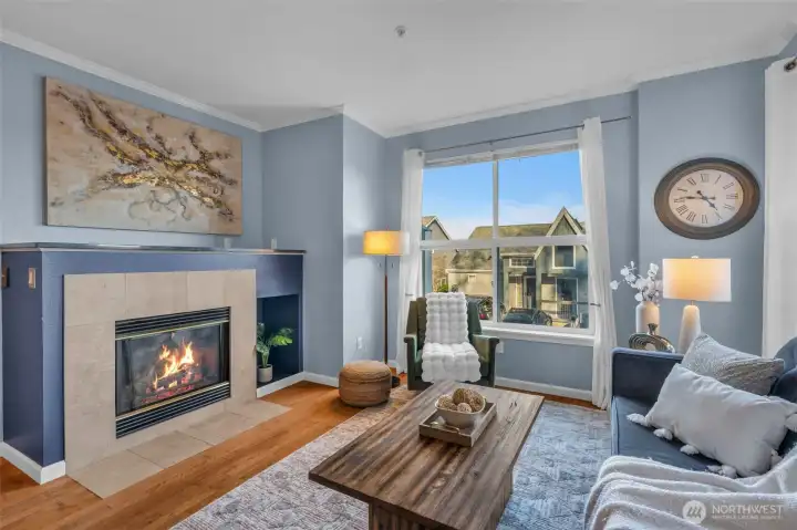 Light filled living room with fireplace.