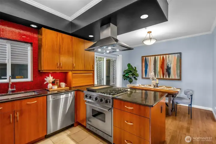 Stunning chef's kitchen opens to Dining room.