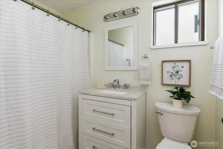 Full bath at top of stairs for bedroom 2's use.