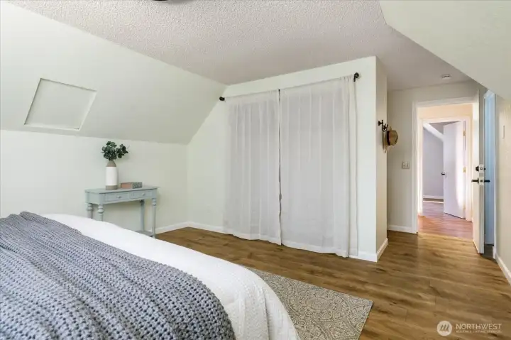 Closet, pocket vanity just past closet, bathroom behind door on right.