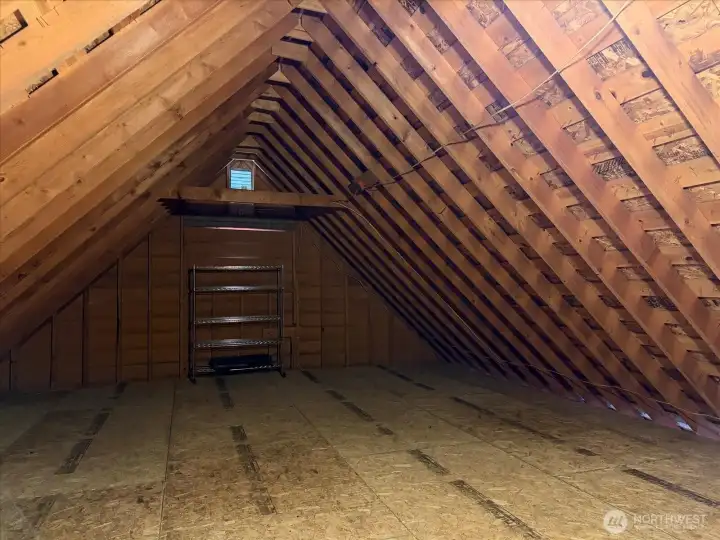 Just climb the easy staircase to access loads of storage area above the main garage.