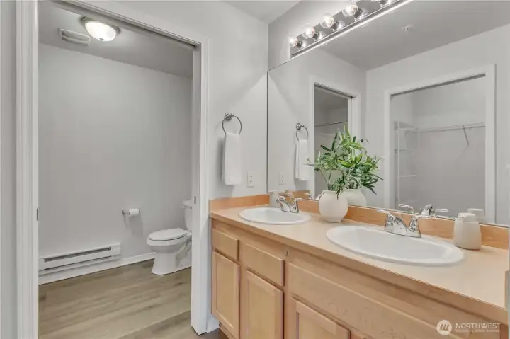 Double Vanity with plenty of storage is accessed just off the primary suite.