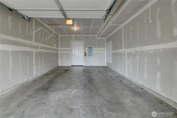 Garage door opener is installed for convenience.