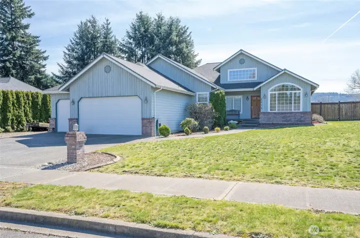 Impressive rambler on a fully fenced corner lot, offering both privacy and curb appeal.
