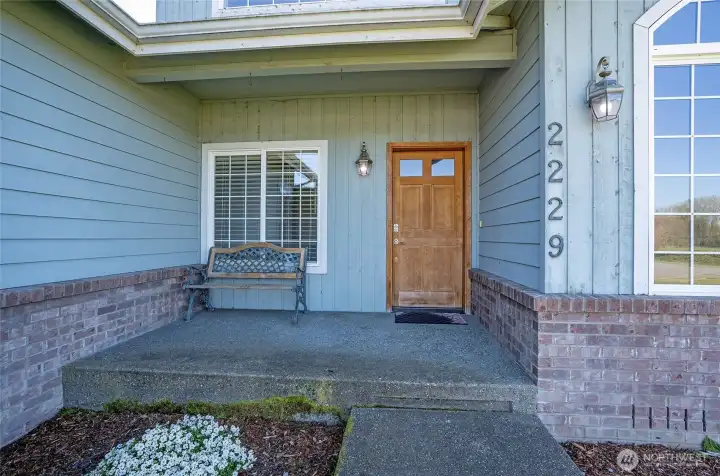Charming covered front porch, perfect for relaxing year-round.