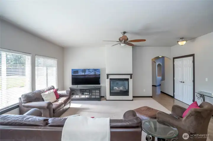 Family room featuring a gas fireplace that provides warmth and a comfortable, inviting atmosphere.