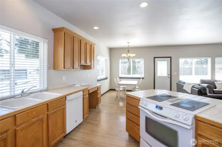 Kitchen with views into the eating area and the adjacent family room, keeping you connected and engaged while entertaining.
