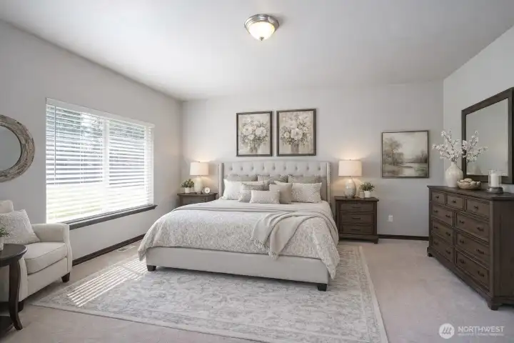 Bright primary suite offering a spacious and comfortable retreat - virtually staged.