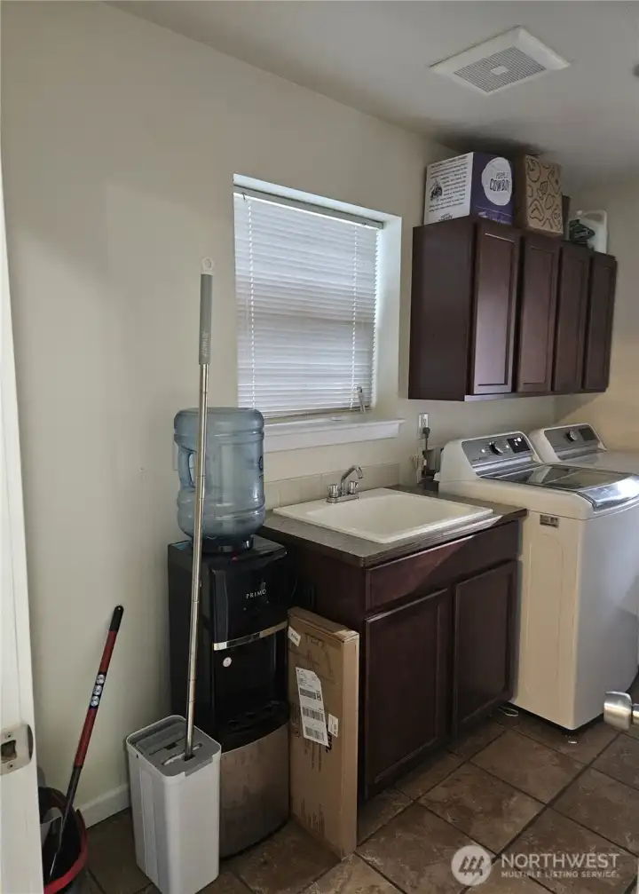 Utility room has space for extra refigerator or deep freezer