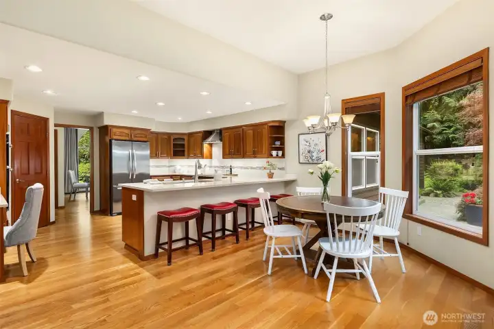 A generous family room with built-in bookshelves adjoins the kitchen and breakfast area, and has French doors leading to a patio.