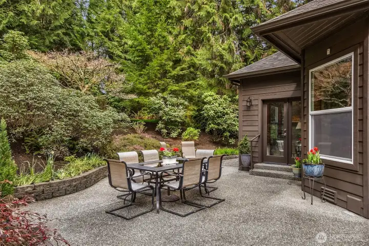 An aggregate patio is accessed from French doors off the family room.