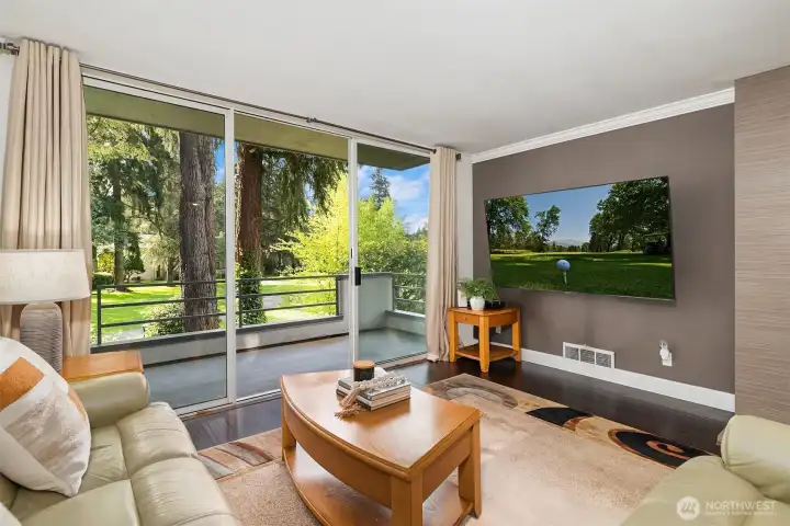 LIVING ROOM WITH WALK OFF PATIO OVERLOOKING THE 8TH TEE BOX