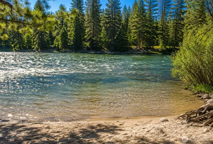 Private community beach access along the river creates the perfect setting for swimming, relaxing, fishing, and enjoying warm summer days surrounded by breathtaking mountain scenery.