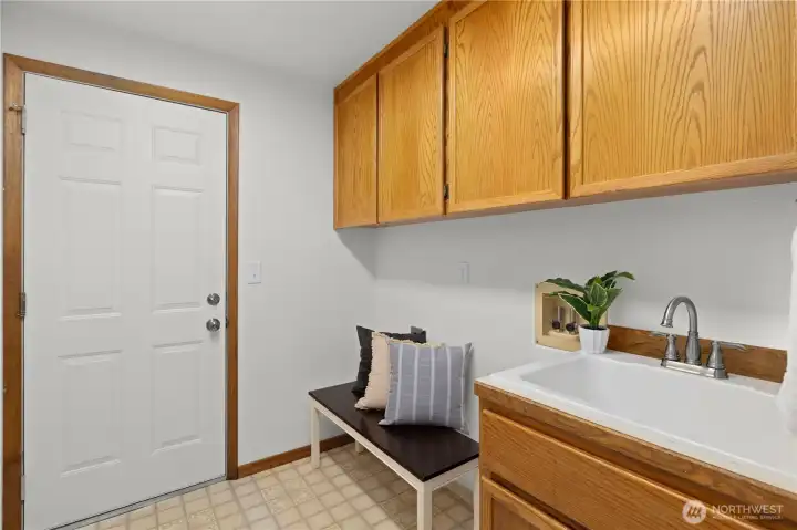 Laundry room equipped with a utility sink and plenty of storage. Laundry room equipped with a utility sink and plenty of storage.