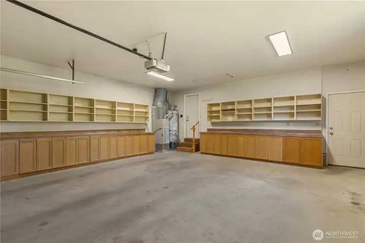 The main house 2-car garage has a plethora of cabinets and storage space including storage up in the attic above. The main house 2-car garage has a plethora of cabinets and storage space including storage up in the attic above.