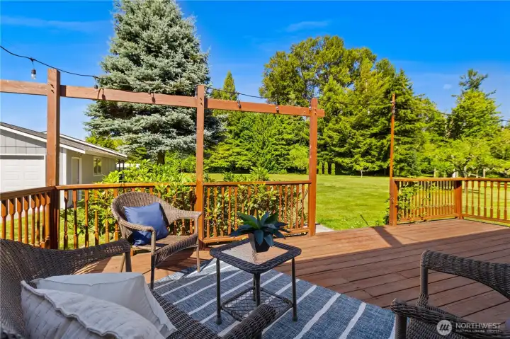 Expansive back deck overlooking the 3 acres space. Expansive back deck overlooking the 3 acres space.