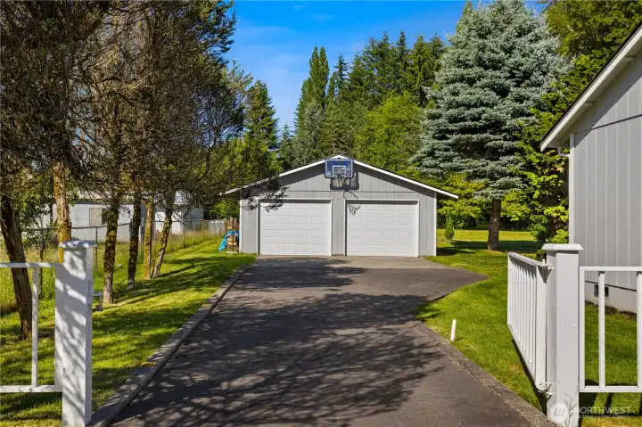The 2-car detached garage/shop has its own driveway. The 2-car detached garage/shop has its own driveway.