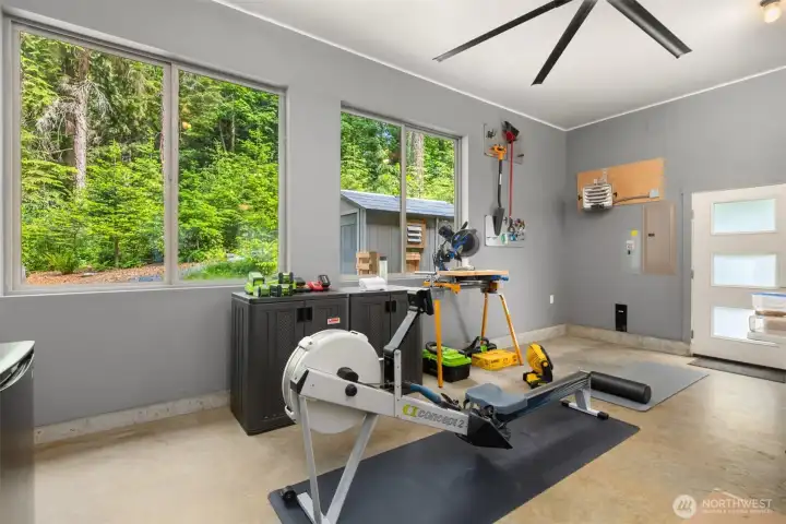 800+ SF Garage  Oversized, finished flex space with forest views on both sides — ideal as a workshop or fitness studio. Dual EV chargers, ceiling fan, heater, and an ultra-quiet belt-drive opener.