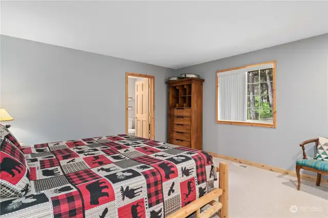 Main floor bedroom with King size bed and adjoining 3/4 bath off Living room