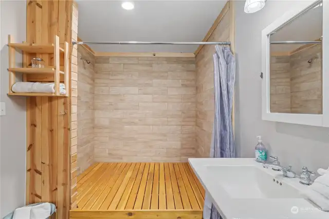 Tiled shower in Main floor bedroom off living room.