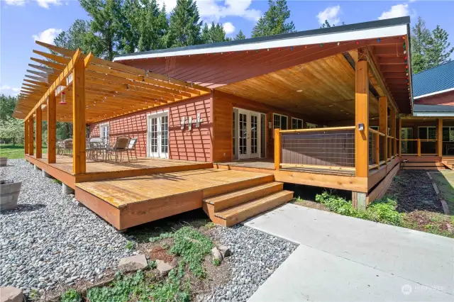 Side access from Great room to lighted Pergola deck