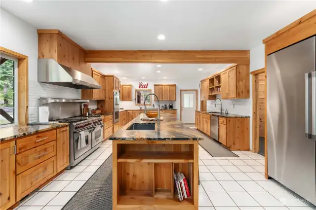 The centerpiece of this magnificent property has to be this newly remodeled kitchen with Dacor double built in convection ovens and a Commercial Wolf six burner range with double ovens and flat grill