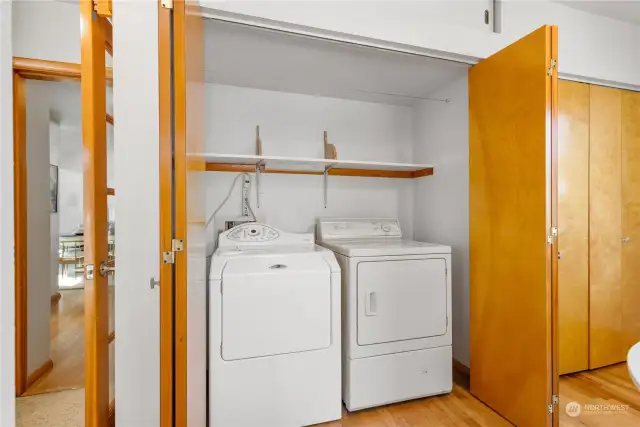 Laundry closet off casual dining/office/play space.