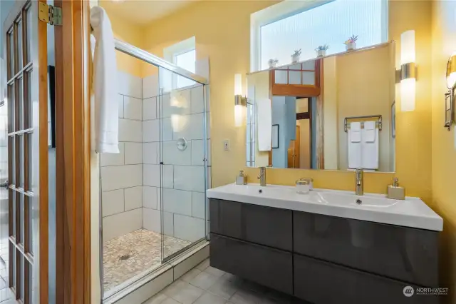 Lower level bath with huge walk in shower. 11' ceiling.
