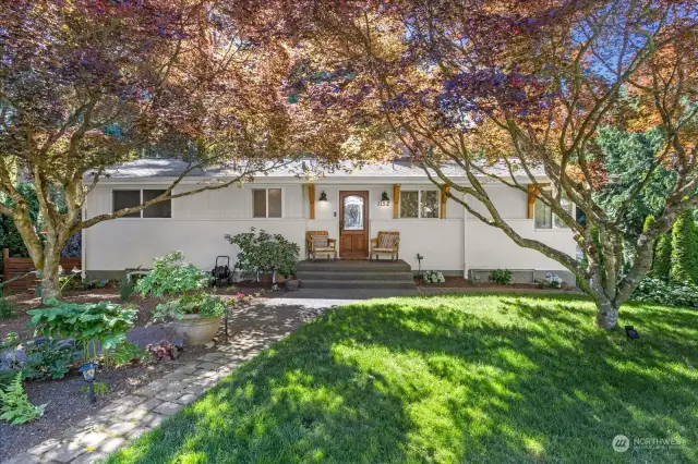 Welcome to this charming mid-century home with an inviting mix of classic and updated features.