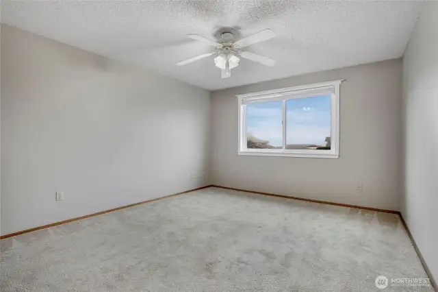 Another view of the primary bedroom