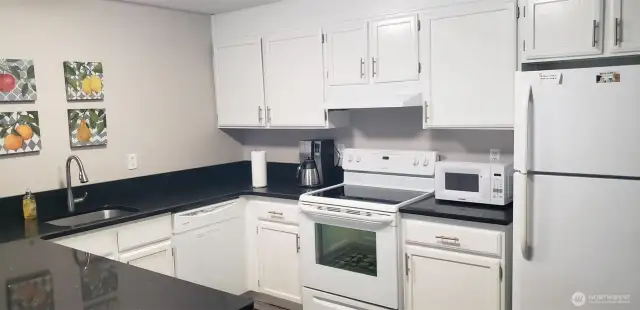 The community has a full kitchen with plenty of counter space for parties and cooking.