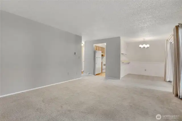 Another view of the living room facing the dining room and kitchen. This unit has a really nice flow.