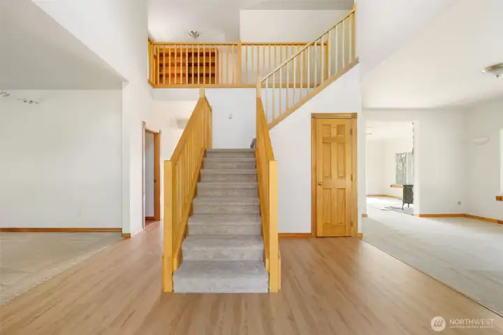 Entry with hardwood floors.