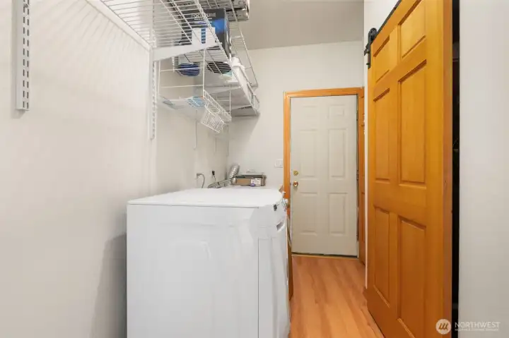 Washer and dryer are on main level as well as furnace and hot water tank.  Exterior door.
