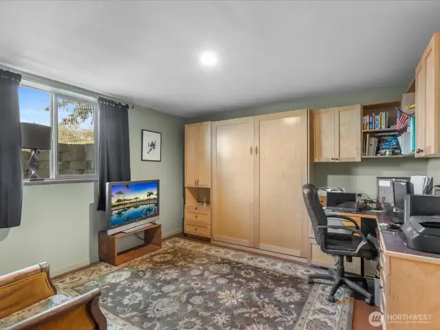 Lower level den/office/guest room with ensuite 3/4 bath. Wall unit contains a Murphy Bed!