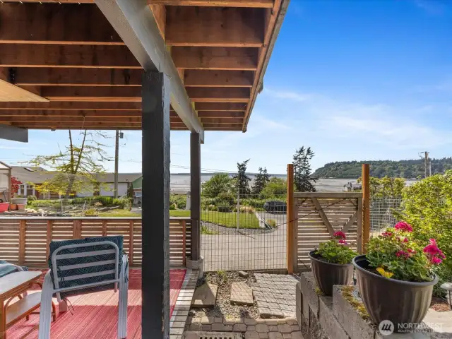 Patio  under deck with entry from driveway.