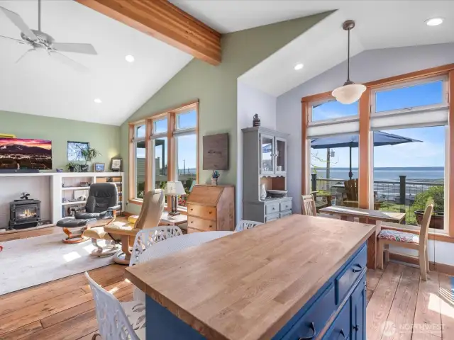 Open plan Kitchen, Dining and Living room features beamed vaulted ceiling and stunning views.