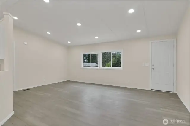 View from dining area into Oversized living room with new luxury Vinyl flooring!