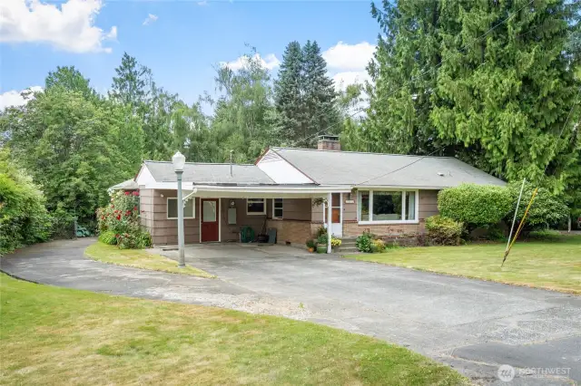 Charming single-story 3 bedroom and 1 1/2 bath home with a spacious carport.  Huge garage sits behind the home and new zoning regs allow for the property to be split and ADU's added.