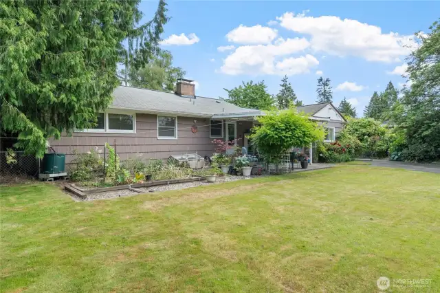 Garden-ready yard with curated greenery and space to grow, perfect for plant lovers!