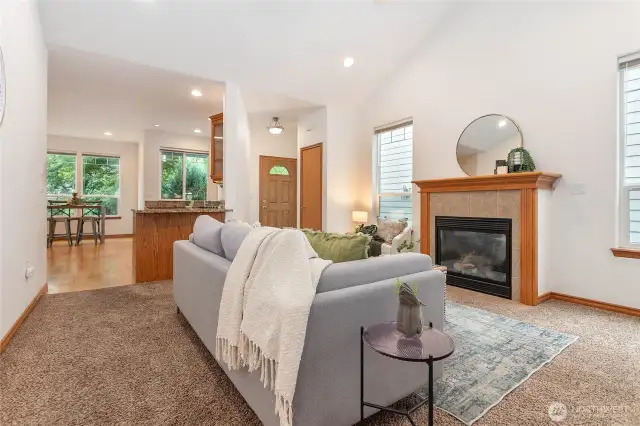 Open living room giving way to eat-in kitchen