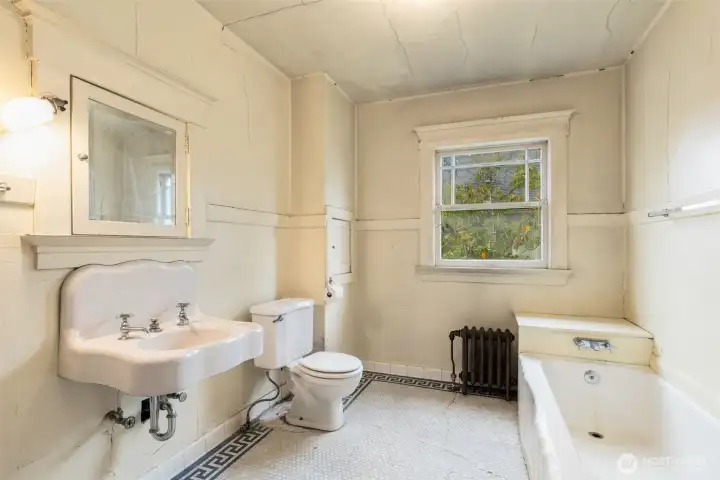Full bath on upper - original tiled floor