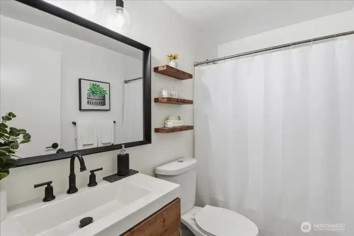 Full bathroom with shower and tub
