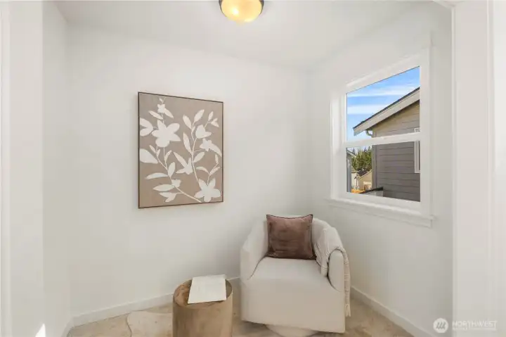 Primary Suite Sitting Room:  The sitting room within the primary suite offers a quiet, light-filled alcove framed by clean lines and soft carpeting. Its separation from the main sleeping area makes it ideal for reading, meditation, or simply enjoying a private corner of the home. Positioned in the heart of Bothell’s Canyon Park corridor, this added space reflects the community’s blend of comfort and modern livability. The versatility of this area gives the suite a richer, more elevated feel, allowing you to create a retreat that feels truly personal.    These photos are from Lot 5 at Gooden Hollow, the home listed here. However, other homes in the community will have changes, so all photos, renderings, site maps, and floorplans are for visualization purposes only. Plans, colors, building orientation, finishes, home outlook, and other details can and WILL vary.