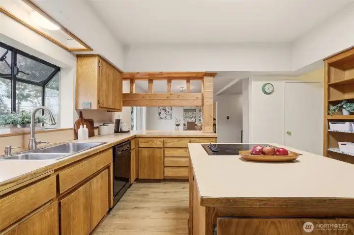 Kitchen features plenty of storage and spaces to gather.