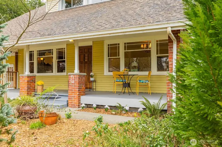 Oversized front porch with historic charm and character.