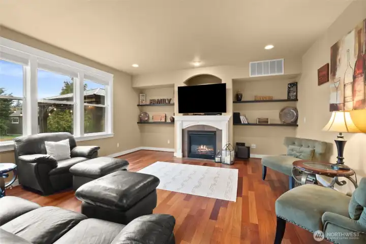 Light-filled living room with natural gas fireplace for year-round comfort.