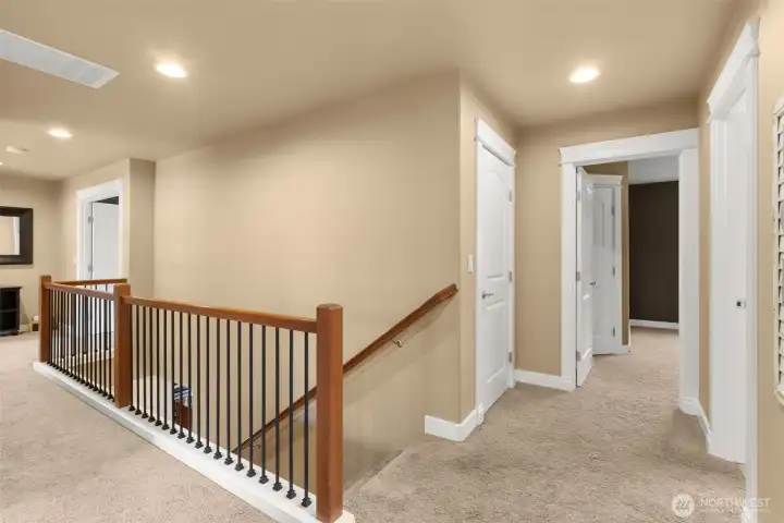 Elegant wrought iron staircase adds architectural distinction.